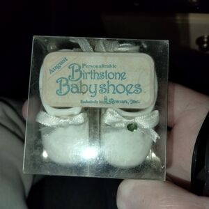 White Baby Shoes with Green Gem